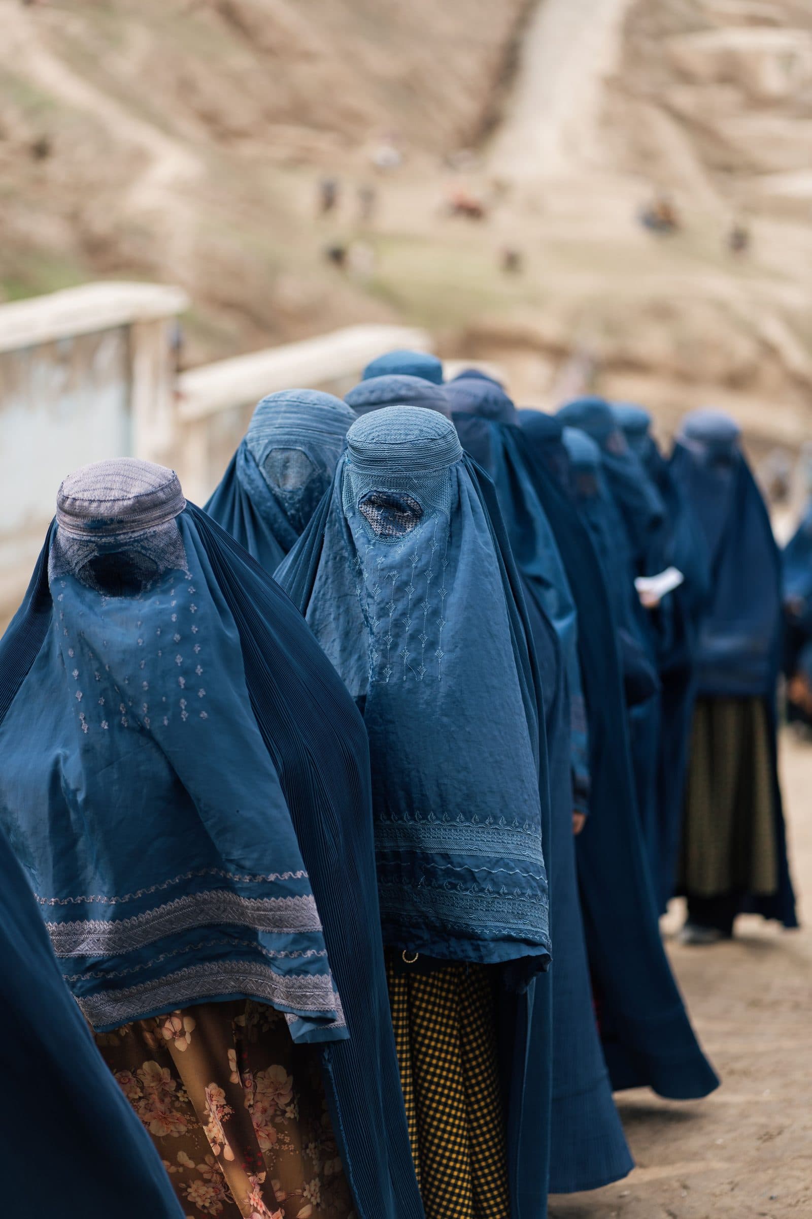Afghan women in traditional clothing in a mountainous area of Afghanistan